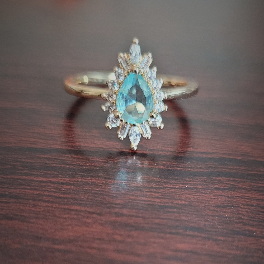 Gold Plated Ring with Teardrop Blue Gemstone and Accent Stones